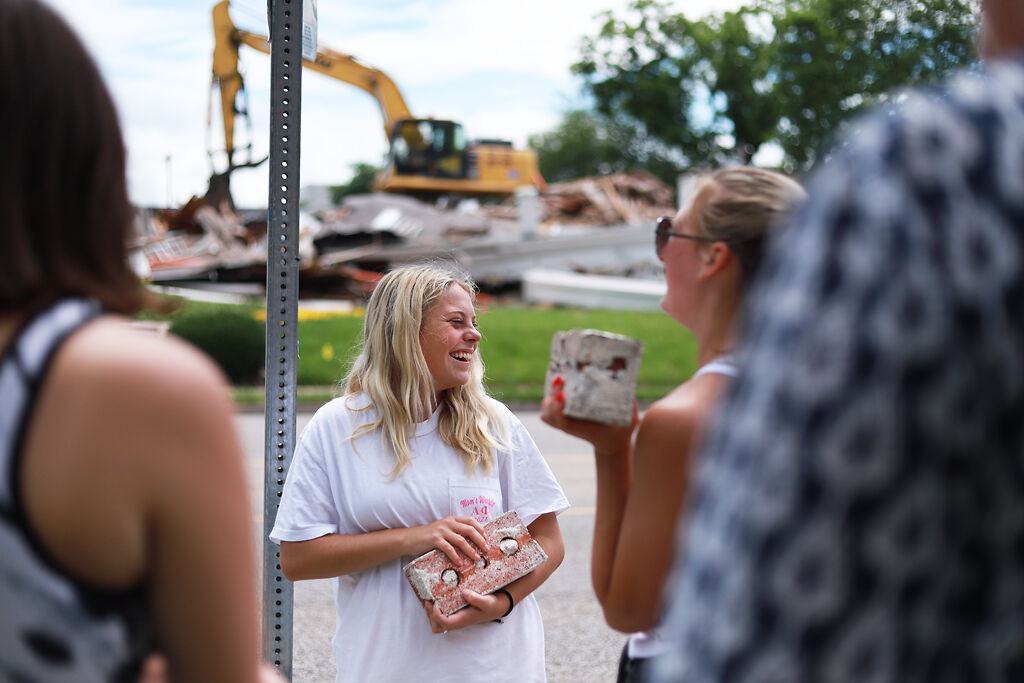 Hannah Moore holds a brick